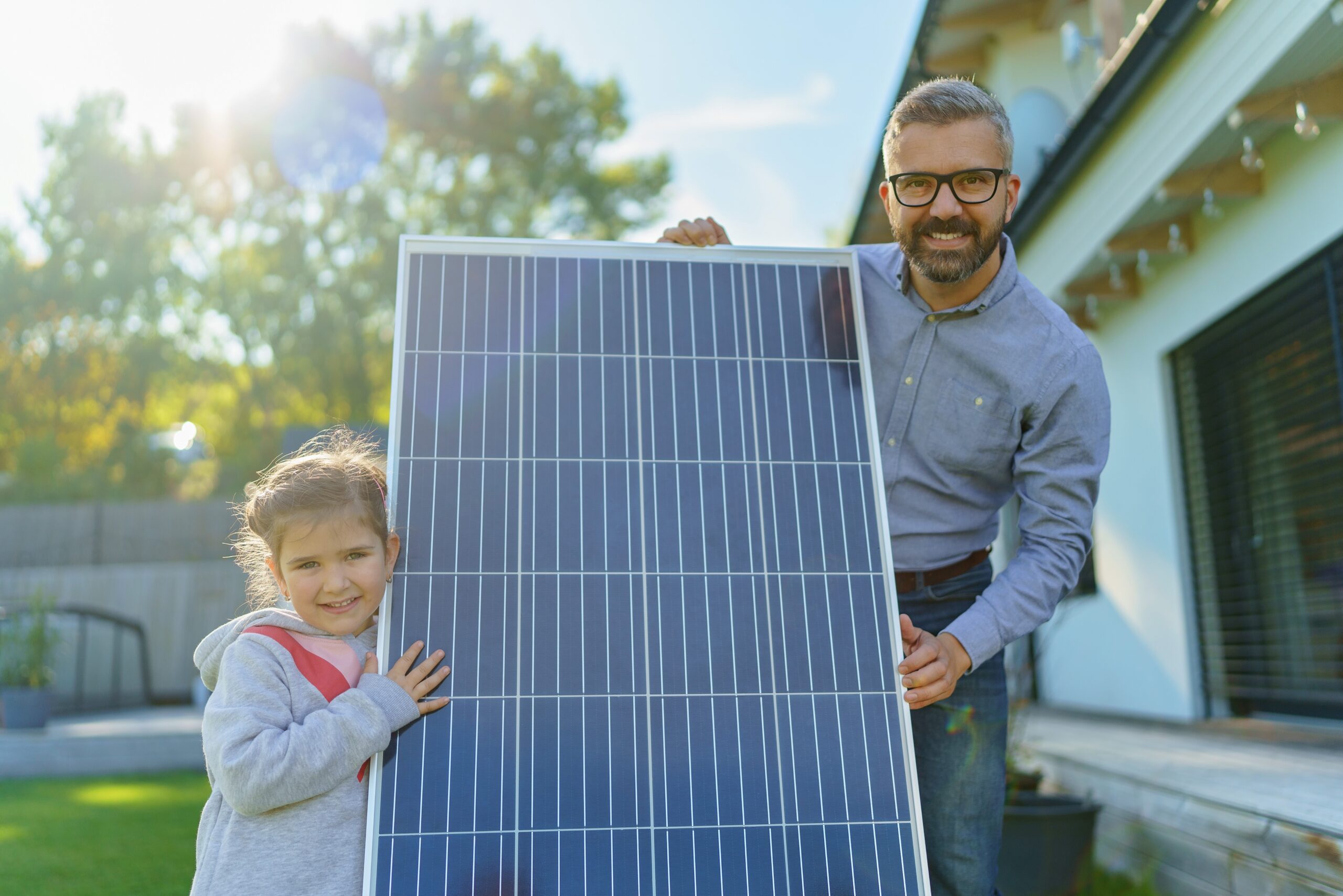 Father and Daughter excited showing off a new solar panel for their home